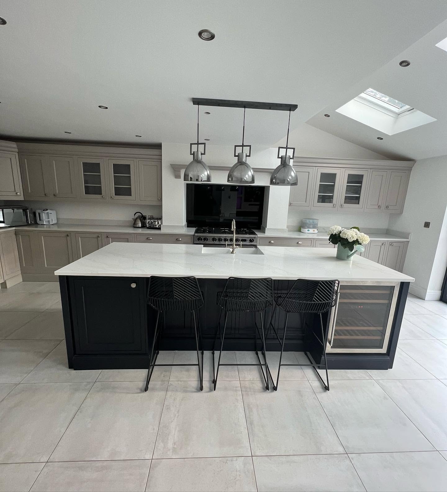 Premium fitted kitchen with large island, pendant lighting and roof lantern by Ultra Build Northwest, Manchester