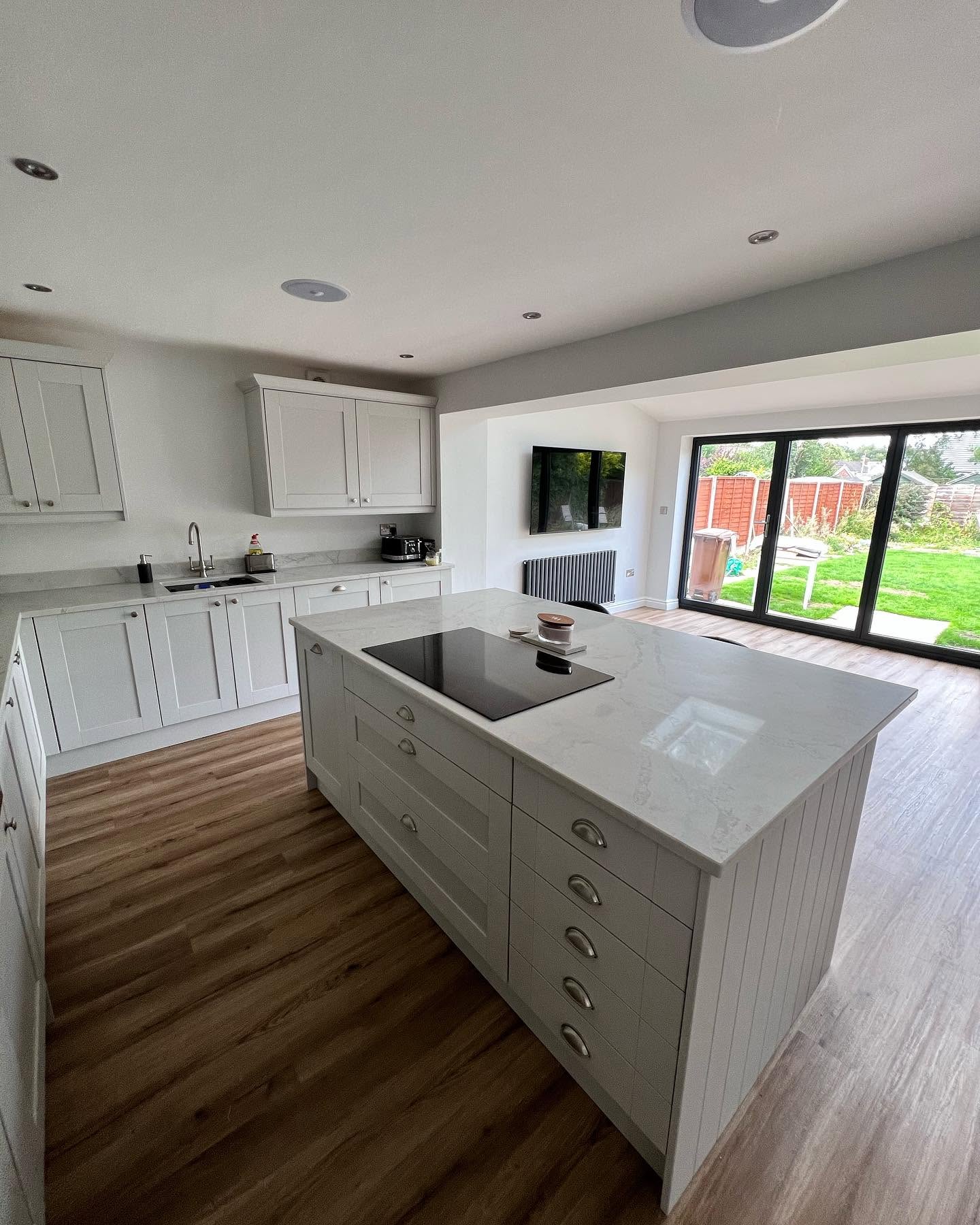 Shaker-style fitted kitchen in white with integrated appliances