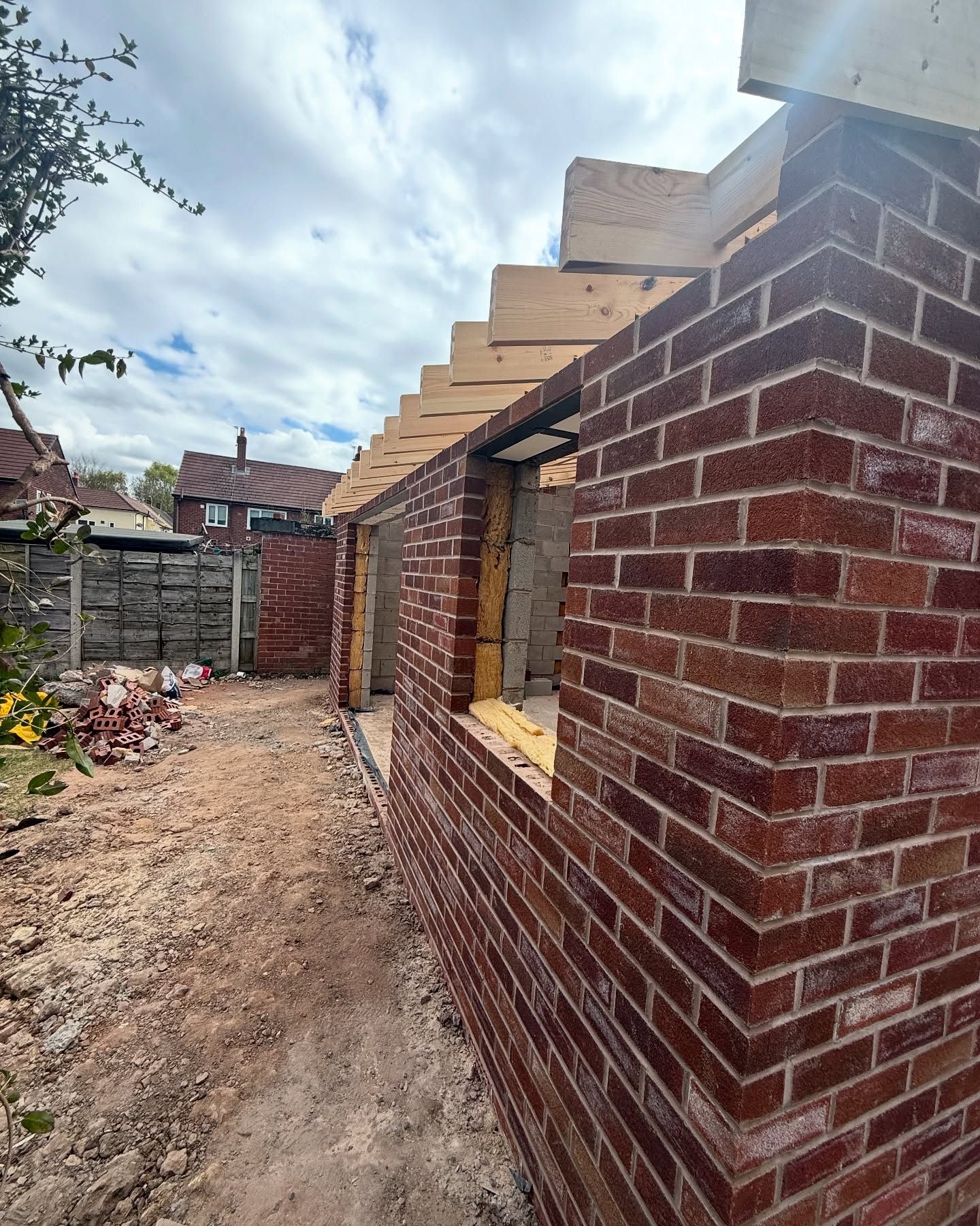 New facing-brick wall and quoin detail on a recently completed extension, Greater Manchester